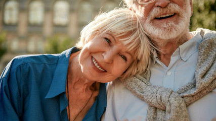 If it is real, it will never be over. Happy senior couple bonding to each other and smiling while...