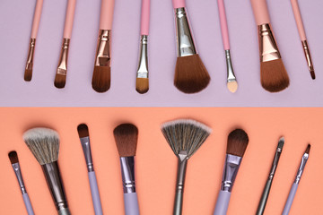 Fashion cosmetic makeup autumn Set. Collection beauty product on coral purple background. Trendy accessories Brushes Eyeshadow art fashionable layout. Creative Flat lay, make up fall autumnal concept
