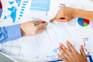 Business meeting concept, hands and financial charts