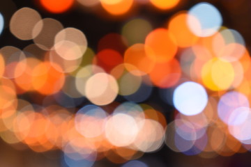 Fototapeta premium Bokeh light of orange, red, blue, coourful light for abstract background
