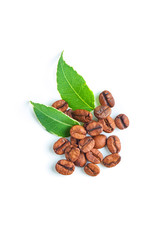 Coffee beans and leaves isolated on white background, closeup. Top view.