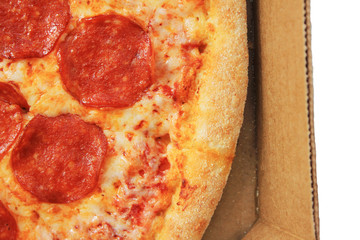 Pizza with pepperoni sausage close up. Classic italian meal isolated on white table background. Pizza delivery concept 