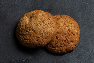 Oatmeal cookies plan on a black background