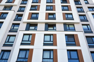 Modern luxury urban apartment building exterior with blue sky