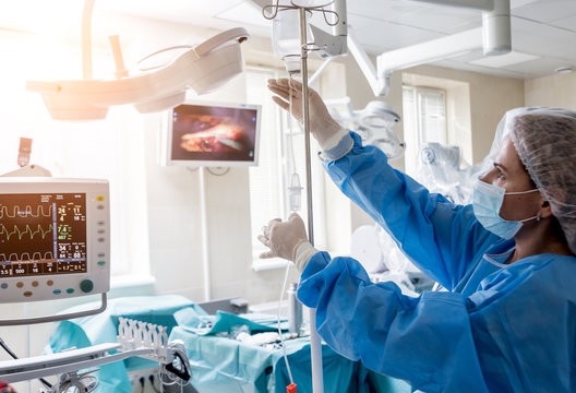 Medical Drip Tubing And Patient At The Hospital.