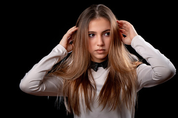 portrait of beautiful teenager girl on black background