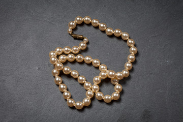 Pearl necklace on a black background