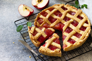 Homemade baking. Autumn apple pie on a light stone or slate table. Free space for your text.