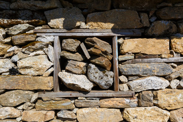 old window in an abandoned barn stoned