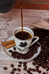 Vintage coffee cup and coffee beans