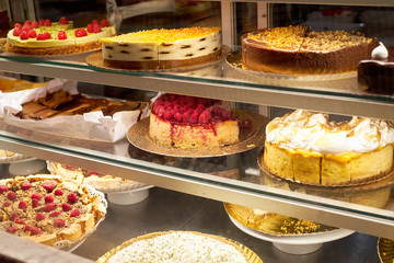 Confectionary display with various tarts, cakes and cheesecakes