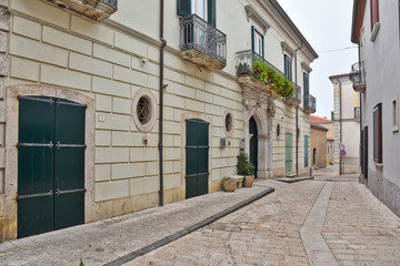Frigento, Italy, 09/28/2019. A narrow street among old buildings of a mountain village.