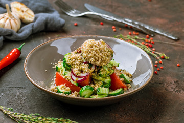 vegetable salad with nuts on dark table