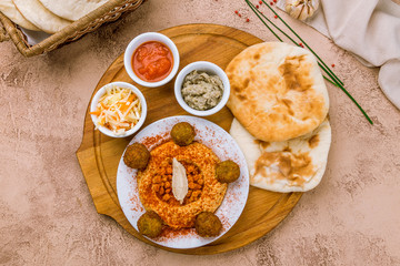 hummus with falafel on the board