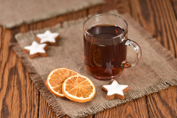 Cup of hot tea on winter evening for Christmas