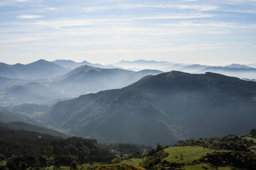 Fototapeta na wymiar Mountains of Encartaciones among the mist of dawn