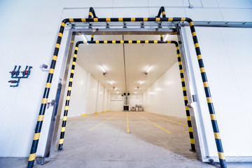 Empty industrial freezer warehouse for vegetable storage.