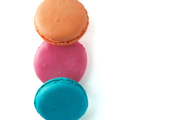 Macaroons box top view. Sweet french macaroons cake on the white background.