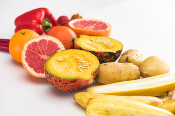Fototapeta na wymiar potatoes, zucchini pumpkin, peppers, orange and grapefruit on white background
