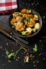 Fried chicken fillet with vegetables.