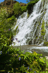 Natural waterfall. Scenery. Summer. Blue sky