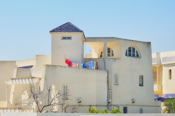 The old Arab house white color of with drying on a rope linen