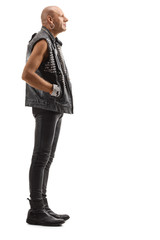 Punker in leather clothes standing