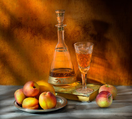 glass of white wine and fruits on wooden table