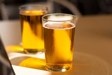 Cold amber color light spanish beer served in glass in outdoor cafe in sunny Andalusia, Spain