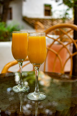 Healthy breakfast with two glasses of freshly squeezed orange juice