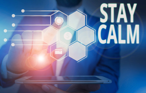 Conceptual hand writing showing Stay Calm. Concept meaning Maintain in a state of motion smoothly even under pressure Male wear formal suit presenting presentation smart device