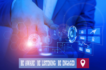 Handwriting text writing Be Aware Be Listening Be Engaged. Conceptual photo take attention to actions or speakers Male human wear formal work suit presenting presentation using smart device