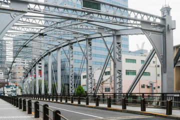 Abstract urban or transportation background featuring details of gray steel bridge frames with...