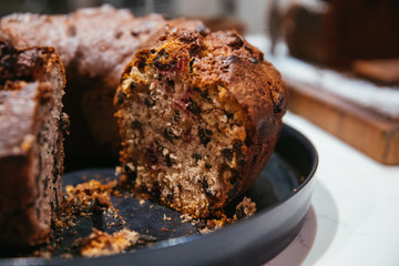 Christmas chocolate or fruit cake on the table. Winter cake in cafe cake shop or coffee shop.