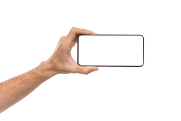 Smartphone with blank screen in horizontal orientation in male hand