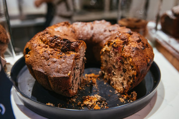 Christmas chocolate or fruit cake on the table. Winter cake in cafe cake shop or coffee shop.