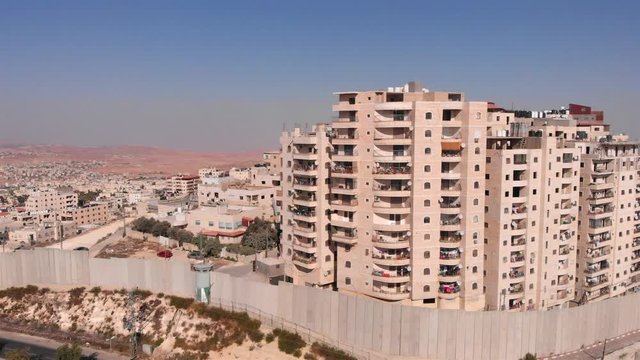 East Jerusalem Palestinian Refugge camp Surrounded By security Concerete Wall Drone Footage of Palestinian Refugge camp Shuafat With Security fence and Army Watch Tower