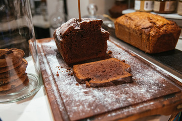 Christmas chocolate or fruit cake on the table. Winter cake in cafe cake shop or coffee shop.