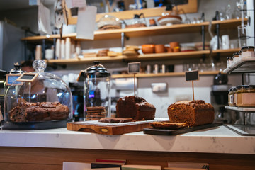 Cake shop, cafe or coffee shop with christmas chocolate or fruit cakes on the table. Winter cakes in cafe or coffeeshop.