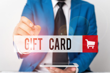 Word writing text Gift Card. Business photo showcasing A present usually made of paper that contains your message Businessman pointing with pen in empty copy space