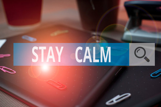 Handwriting text writing Stay Calm. Conceptual photo Maintain in a state of motion smoothly even under pressure Scissors and writing equipments plus math book above textured backdrop