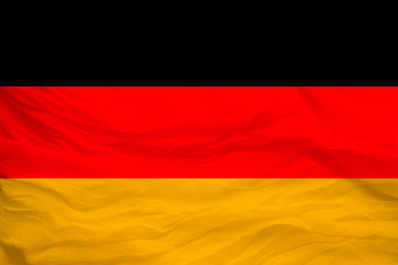 national flag of the country Germany on gentle silk with wind folds, travel concept, immigration, politics, copy space, close-up