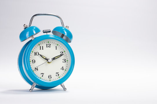 Blue Alarm Clock Isolated On White Background