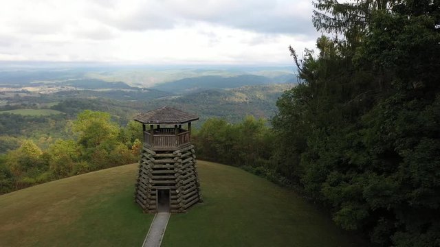 Aerial camera flying towards Droop Mountain State Park&rsquo;s overlook tower.