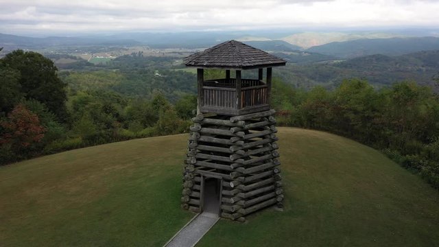 Closeup aerial orbit low and to the left showing the overlook tower at Droop Mountain State Park in West Virginia.