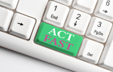 Text sign showing Act Fast. Business photo showcasing Voluntarily move in the highest state of speed initiatively White pc keyboard with empty note paper above white background key copy space