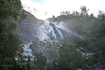 Cascading falls soaking me and my camera. Tasmania.