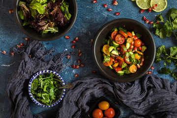 Fresh salad with tomato, cucumber and herbs, flat lay from above