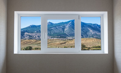 Window view of a beautiful mountain landscape