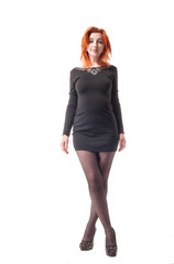 young woman in tight black dress on white background